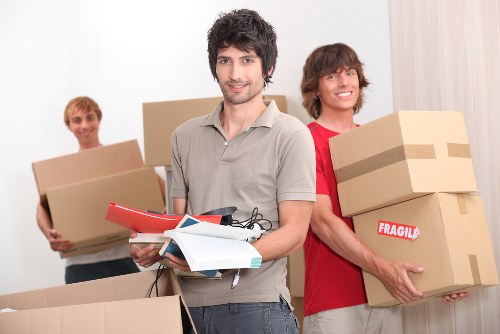 Professional movers organizing belongings
