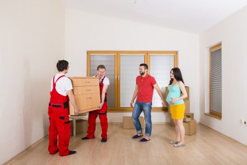 Professional movers handling furniture in Lambeth
