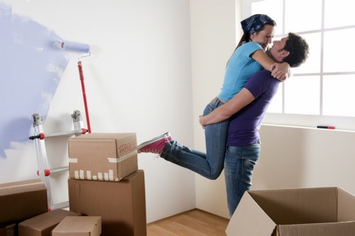 Professional movers loading items into a removal truck